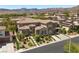 Elegant two-story home features a stone accent, well-manicured landscaping and a paved driveway at 631 Coriander Canyon Ct, Las Vegas, NV 89138