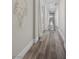 Inviting hallway with hardwood floors, white accents, and stylish decor at 631 Coriander Canyon Ct, Las Vegas, NV 89138