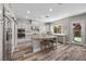 Modern kitchen featuring an island, stainless steel appliances, and lots of cabinets at 631 Coriander Canyon Ct, Las Vegas, NV 89138