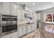 Modern kitchen featuring an island, stainless steel appliances, and granite countertops at 631 Coriander Canyon Ct, Las Vegas, NV 89138