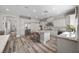 Modern kitchen with an island, stainless steel appliances, and a breakfast bar with stools at 631 Coriander Canyon Ct, Las Vegas, NV 89138