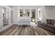 Bright living room with a piano, hardwood floors, and French doors leading to the outside at 631 Coriander Canyon Ct, Las Vegas, NV 89138
