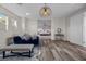 Open-concept living room with hardwood floors, modern decor, and ample seating at 631 Coriander Canyon Ct, Las Vegas, NV 89138