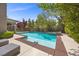 Inviting swimming pool with a spa, lounge chairs, and lush landscaping, creating a private oasis at 631 Coriander Canyon Ct, Las Vegas, NV 89138