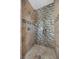 Modern walk-in shower with sleek fixtures and custom tile at 631 Coriander Canyon Ct, Las Vegas, NV 89138