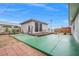 Spacious backyard featuring a large patio area and a detached room, perfect for outdoor entertaining at 6508 Bourbon Way, Las Vegas, NV 89107