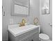 Well-lit bathroom with gold faucet and modern vanity at 6508 Bourbon Way, Las Vegas, NV 89107