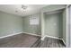This bedroom features wood-look flooring and a box window for additional light at 6508 Bourbon Way, Las Vegas, NV 89107