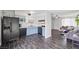 Open-concept kitchen with updated appliances and a seamless flow into the living area at 6508 Bourbon Way, Las Vegas, NV 89107