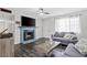 Cozy living room featuring a fireplace, modern decor, and a comfortable seating arrangement at 6508 Bourbon Way, Las Vegas, NV 89107