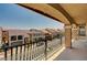 Balcony view of a neighborhood with tile-roofed houses on a clear, sunny day at 6516 Austin Hope Ave, Las Vegas, NV 89118