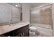 Well-maintained bathroom featuring a tub-shower combination, single sink vanity and new floors at 6516 Austin Hope Ave, Las Vegas, NV 89118