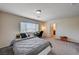 Bright bedroom features natural light, neutral colors, and gray carpet at 6516 Austin Hope Ave, Las Vegas, NV 89118