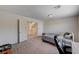 Bedroom features natural light, gray carpet, and closet access at 6516 Austin Hope Ave, Las Vegas, NV 89118