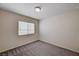 Bedroom with neutral carpeting, a window with blinds, and a ceiling light fixture at 6516 Austin Hope Ave, Las Vegas, NV 89118
