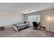 Bedroom features natural light, neutral colors, and gray carpet at 6516 Austin Hope Ave, Las Vegas, NV 89118