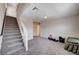 Spacious bonus room features neutral colors, stairs, and gray carpet at 6516 Austin Hope Ave, Las Vegas, NV 89118