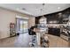Open concept kitchen featuring granite countertops, stainless steel appliances, and access to backyard at 6516 Austin Hope Ave, Las Vegas, NV 89118