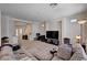 Comfortable living room with plush carpet, large TV, and modern decor at 6516 Austin Hope Ave, Las Vegas, NV 89118