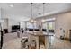 Open-concept kitchen and living room with granite island, stainless steel appliances and backyard access at 6516 Austin Hope Ave, Las Vegas, NV 89118