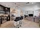 Open-concept kitchen and living room area with granite island and stainless steel appliances at 6516 Austin Hope Ave, Las Vegas, NV 89118