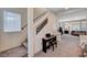 Spacious living room with staircase, carpet, and abundant natural light at 6516 Austin Hope Ave, Las Vegas, NV 89118