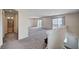 Spacious upstairs loft area with plush carpets and balcony access through sliding glass doors at 6516 Austin Hope Ave, Las Vegas, NV 89118