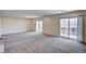 Expansive loft featuring plush carpets, recessed lighting, and balcony access through sliding glass doors at 6516 Austin Hope Ave, Las Vegas, NV 89118