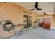Covered outdoor patio featuring a ceiling fan, brick privacy wall, and a table with chairs at 6516 Austin Hope Ave, Las Vegas, NV 89118