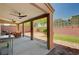 Covered outdoor patio featuring a ceiling fan, brick privacy wall, and a table with chairs at 6516 Austin Hope Ave, Las Vegas, NV 89118