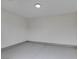 Clean and empty garage featuring an epoxy floor, neutral walls, and recessed lighting at 6549 Gazelle Dr, Las Vegas, NV 89108