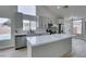 Bright kitchen features an island, stainless steel appliances, and light wood floors at 6549 Gazelle Dr, Las Vegas, NV 89108