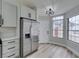 Updated kitchen featuring stainless steel refrigerator and access to the front door at 6549 Gazelle Dr, Las Vegas, NV 89108