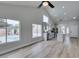 Bright and open living room featuring tile flooring, vaulted ceilings and view to the kitchen and pool at 6549 Gazelle Dr, Las Vegas, NV 89108