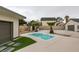 Backyard view showcasing the in-ground pool, small palm trees, shed, and hardscape at 6549 Gazelle Dr, Las Vegas, NV 89108