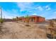 The large backyard presents opportunities for custom landscaping and outdoor activities, set in a desert landscape at 6661 Gallup Ct, Pahrump, NV 89060