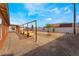 Large backyard features a wooden frame and some small trees and an opportunity for a personalized outdoor oasis at 6661 Gallup Ct, Pahrump, NV 89060