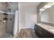 Modern bathroom featuring a sleek walk-in shower, elegant vanity, and contemporary fixtures at 6661 Gallup Ct, Pahrump, NV 89060
