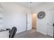 A bright bedroom space with a large decorative clock at 6661 Gallup Ct, Pahrump, NV 89060