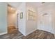 Inviting home foyer with decorative touches and wood flooring at 6661 Gallup Ct, Pahrump, NV 89060