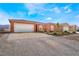 Charming single-story home with desert landscaping and a spacious two-car garage at 6661 Gallup Ct, Pahrump, NV 89060