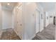 Hallway with modern wood-look floors and white doors at 6661 Gallup Ct, Pahrump, NV 89060