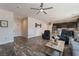 Open-concept living room featuring wood flooring and abundant natural light at 6661 Gallup Ct, Pahrump, NV 89060