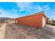 Side exterior of home with desert landscaping and a spacious driveway at 6661 Gallup Ct, Pahrump, NV 89060
