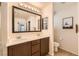 Contemporary bathroom featuring a double sink vanity, framed mirror, and updated finishes at 7154 Brighton Village St, Las Vegas, NV 89166