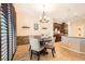 Cozy dining area features a stylish chandelier, modern decor, and comfortable seating at 7154 Brighton Village St, Las Vegas, NV 89166