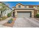Beautiful home featuring stone accents, a two-car garage, and a paved driveway at 7154 Brighton Village St, Las Vegas, NV 89166