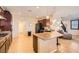 Open kitchen with dark wood cabinets, granite countertops, and tile flooring at 7154 Brighton Village St, Las Vegas, NV 89166