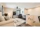 Cozy living room with comfortable seating, ceiling fan, and plenty of natural light at 7154 Brighton Village St, Las Vegas, NV 89166