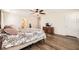 Spacious main bedroom with wood-look floors and a cozy aesthetic at 7154 Brighton Village St, Las Vegas, NV 89166
